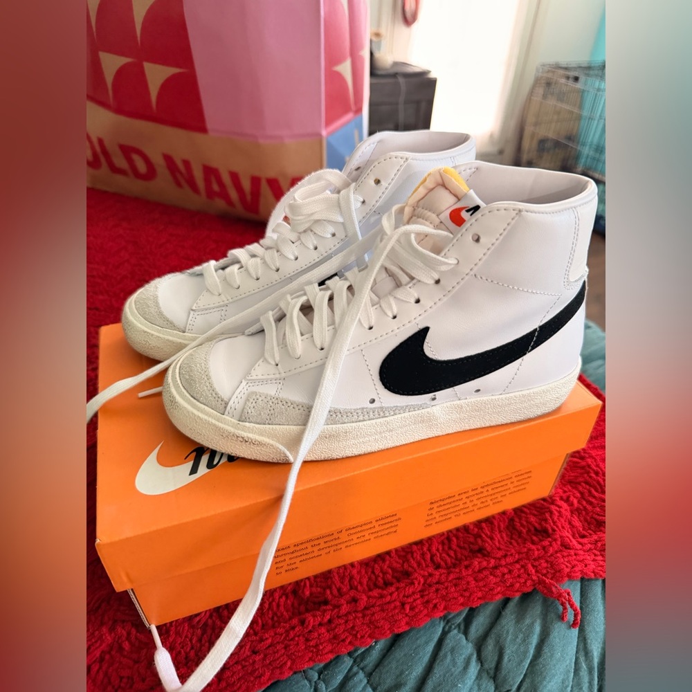 Nike White High-Top Sneakers with Black Swoosh